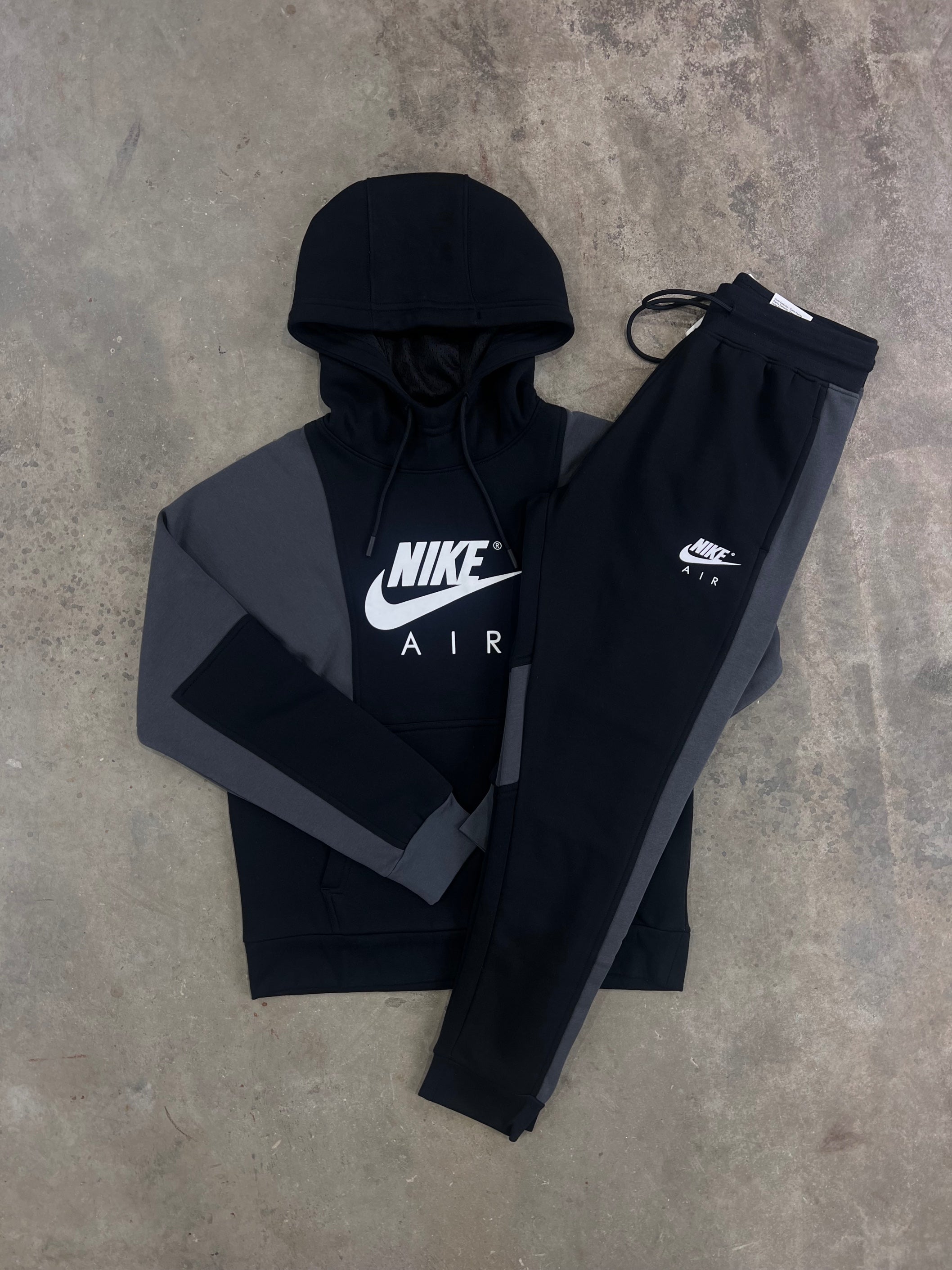 Nike tracksuit all black online